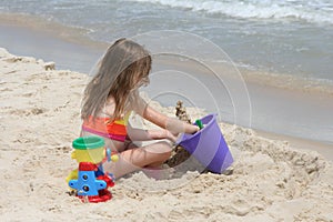 Girl building sand castle 3