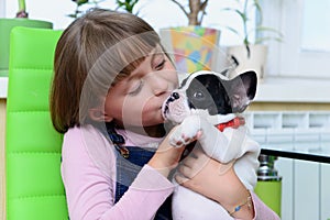Girl with Bulldog puppy