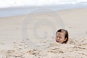 Girl Buried in Sand