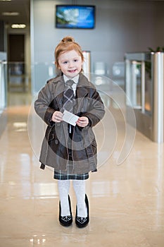 A girl in a business clothes at the entrance to