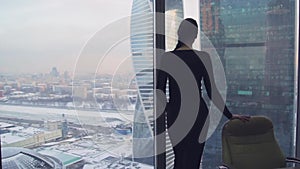 Girl business lady in the office in a skyscraper