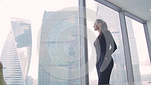 Girl business lady in the office in a skyscraper