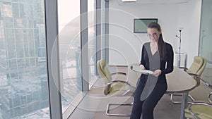 Girl business lady in the office in a skyscraper