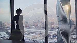 Girl business lady in the office in a skyscraper