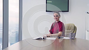 Girl business lady in the office in a skyscraper