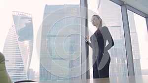 Girl business lady in the office in a skyscraper