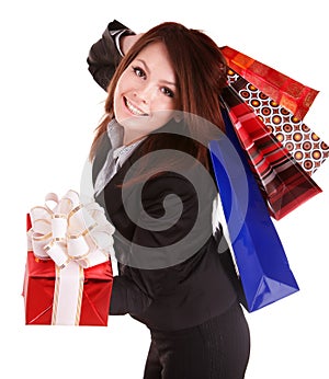 Girl in business suit with group gift box and bag.