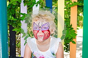 Girl with butterfly face painting