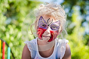 Girl with butterfly face painting