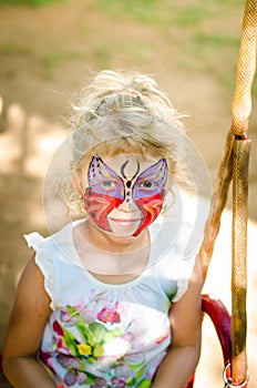 Girl with butterfly face painting