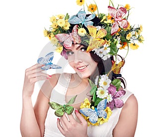 Girl with butterfly and flower on head.