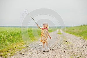 Girl with butterfly net having fun