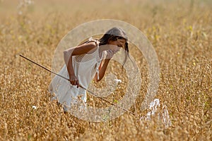 Girl with butterfly net and a white dress