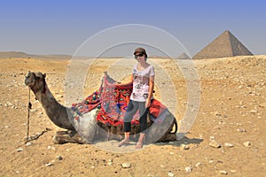 Girl, Camel and Egyptian Pyramid