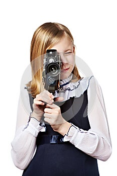 Girl cameraman filming with retro camera