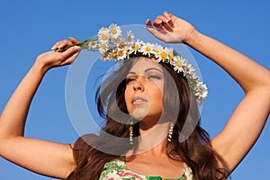 Girl on camomile field