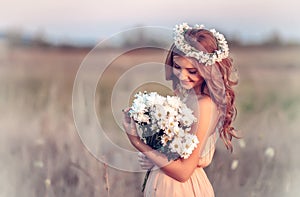 Girl in a camomile wreath