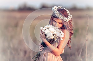 Girl in a camomile wreath