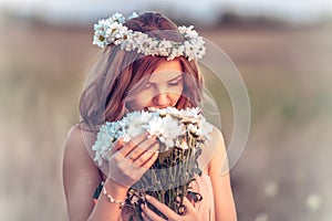 Girl in a camomile wreath