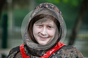 Girl in camouflage before paintball game