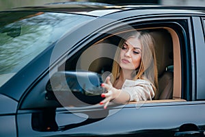 Girl in car arrange mirrow