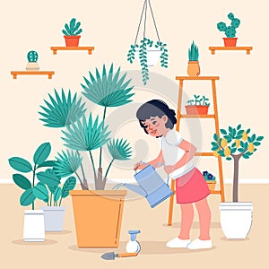 Girl cares house plants. Cute little gardener watering potted flower at room, home greenhouse, kids hobby