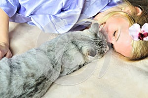 Girl with caressing cat photo