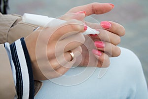 Girl caring for cuticles for a walk photo