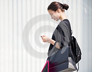 Girl carrying a alot of shopping bags lifestyle concept