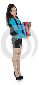 The girl carrying folders