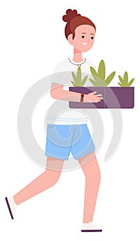 Girl carrying seedlings and sprouts in box. Kid gardening