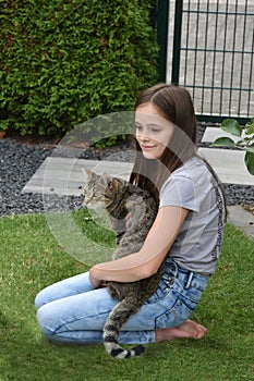 Girl and cat playing