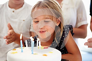 Girl Celebrating Birthday With Cake
