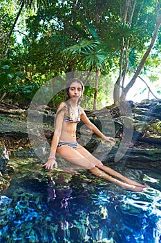 Girl in Cenote at Riviera Maya of Mexico