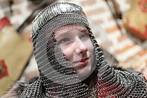 Girl in chain mail helmet