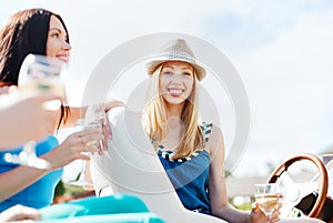 Girl with champagne glass on boat