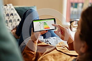 Girl checking the energy efficiency of her home