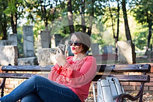 Girl Checking Her Lipstick Using Cellphone Instead Mirror