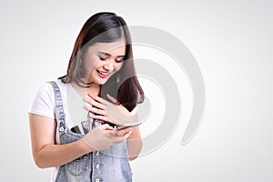 Girl checking phone with joy, isolated copy-space