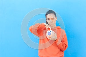 Girl Checking Piggy Bank for Money Savings