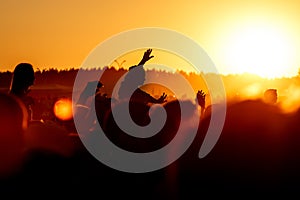 Girl cheering at outdoor music, rock festival