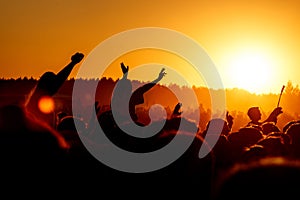 Girl cheering at outdoor music, rock festival