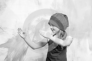 Girl in chef hat and apron with karate hand gesture