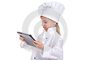 Girl chef white uniform isolated on white background. Holding and looking at the ipad. Landscape image