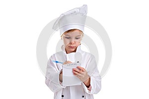 Girl chef white uniform isolated on white background. Holding and writing the note with a pen. Landscape image