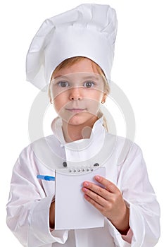 Girl chef white uniform isolated on white background. Holding and writing the note with a pen. Looking at the camera