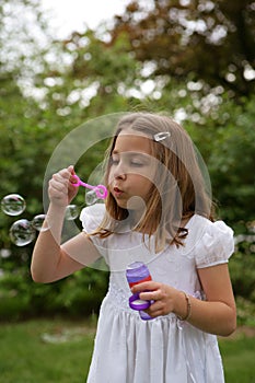 Girl or Child Blowing Bubbles