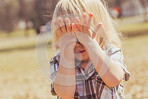 Girl Child Covering Her Eyes