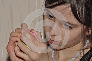 The girl, a child doing Christmas decorations.