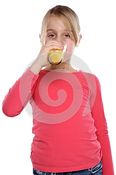 Girl child drinking orange juice healthy eating portrait format